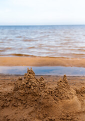 Sand castle by the water