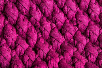 Knitting texture. Macro photo. Handmade. Threads and Texture of knitted garments. Hand crochet close-up. Threads tied in a pattern