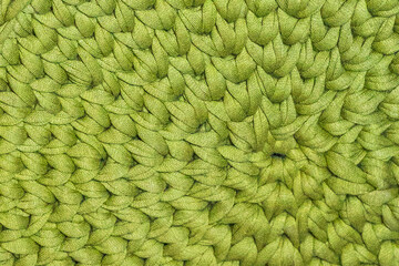 Knitting texture. Macro photo. Handmade. Threads and Texture of knitted garments. Hand crochet close-up. Threads tied in a pattern