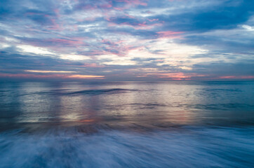 Colorful Sun Sky and reflections in water