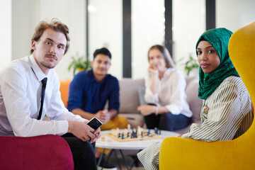 multiethnic group of business people playing chess
