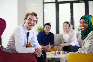 multiethnic group of business people playing chess