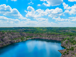 Migia radon radioactive lake. Abandoned granite quarry in Mykolaiv region, Ukraine. Stock photo.