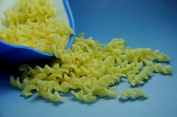 Dried macaroni pasta in bowl