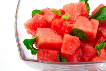 Watermelon salad with mint close-up on white background
