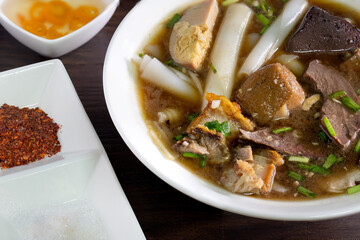 Chinese roll noodle soup with crispy pork, Thai language called *Kuay Jab* and seasoning Chinese food