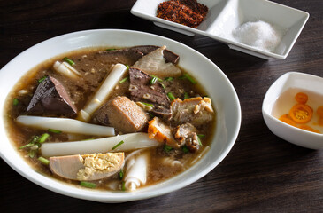 Chinese roll noodle soup with crispy pork, Thai language called *Kuay Jab* and seasoning Chinese food