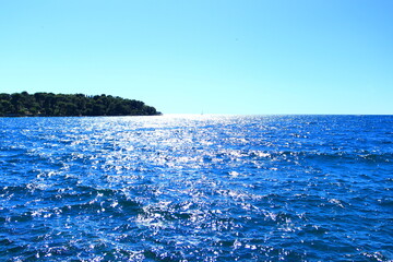 Sailing ship on horizon of blue Adriatic sea near Rovinj travel destination, Croatia
