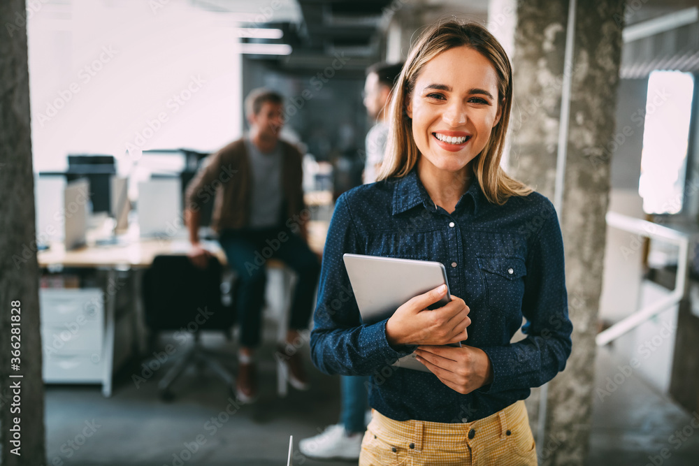 Wall mural Successful company with happy employees in modern office