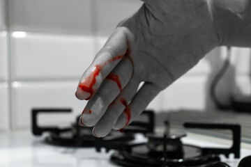 Female cut finger in kitchen - accident while cutting - blood on finger