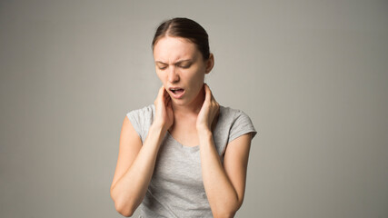 Tired woman feeling pain, massaging tense muscles