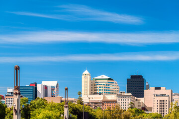 Adelaide CBD skyline viewed from King William street on a bright day against blue sky