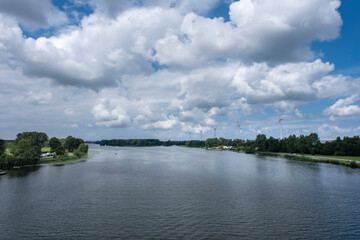 Row of wind turbines and trees at Lake Brielse Meer near Brielle, Netherlands