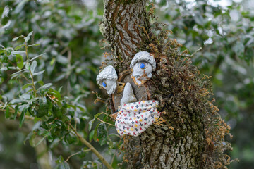 Tree Decorated with Face and Face Mask during Covid-19 Pandemic