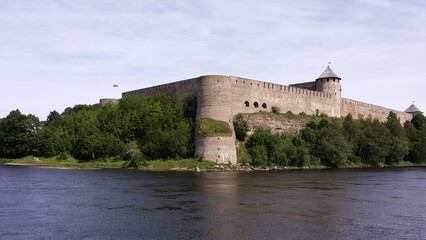 Fototapeta na wymiar Well Tower (Kolodeznaya Bashya) with a cache. Ivangorod Fortress, Russia.