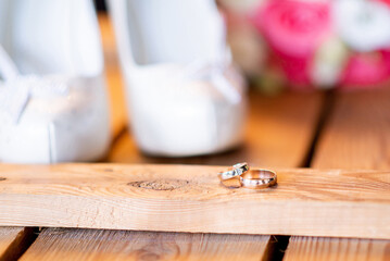 whitewedding shoes of the bride and a wedding bouquet