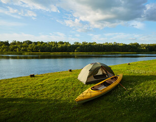 Rafting on kayak. A tent stands on the river bank. © sarymsakov.com