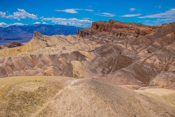 Fototapeta na wymiar View from Zabriskie Point with its interesting looking erosional landscape. In the Death Valley National Park, USA.