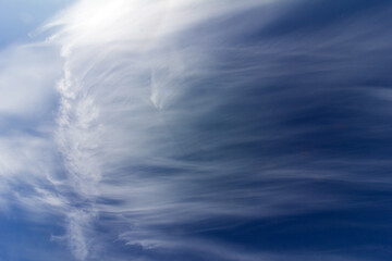 beautiful cloudy landscape with sunlight and cirrus clouds on blue sky