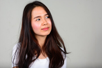 Fototapeta premium Portrait of young beautiful Asian teenage girl