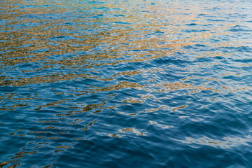 Obraz premium Sea background. Light blue and dark blue colors. Sun reflection on water.