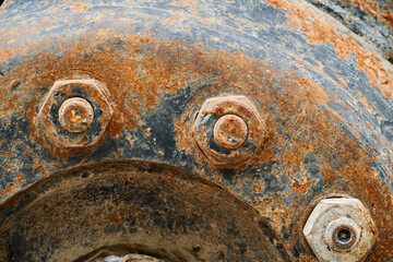big wheel close view of old tractor as background