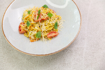 Italian traditional cuisine: vegetarian pasta with zucchini and carrots.