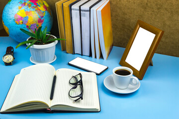 Fototapeta na wymiar Office workplace documents, glasses, coffee, notebook Blue background