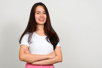 Fototapeta premium Portrait of happy young beautiful Asian woman