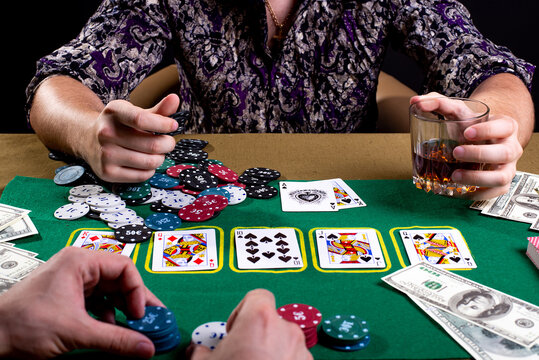 poker table with cards and money croupier hands with chips