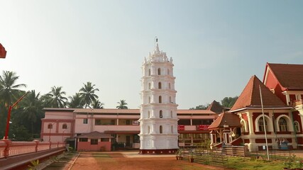 Kavlem, Phonda, Goa, India. Shree Shantadurga Mandir, Kavlem Temple. Famous Landmark And Popular Destination. White Lamp Tower. Shantadurga Devi. Slow Motion