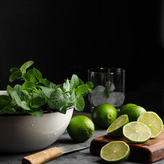 Lime and peppermint on a dark background.