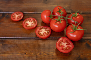 tomato on a brown wooden background, top view, text space, fresh vegetables