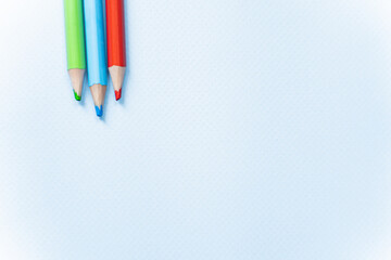 colored pencils on a white background
