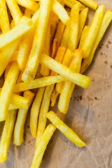 French fries on a paper bag, delicious fastfood