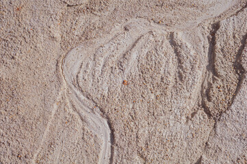 Background from blurred white clay rainy water, natural material, atmospheric impact, outdoors.