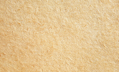 Light brown fibrous kraft paper texture close up