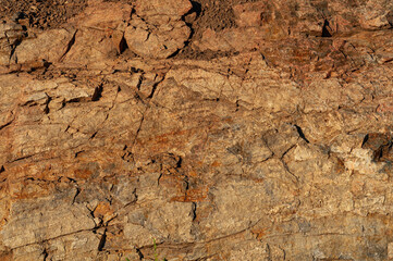 Background from with granite rocks, old cracked weathered stones, atmospheric influence, outdoors.