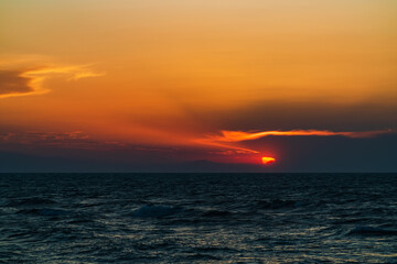 Dark dramatic sunset on ocean