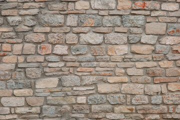An old stone medieval wall, a natural background, a replica of the cosmos.
