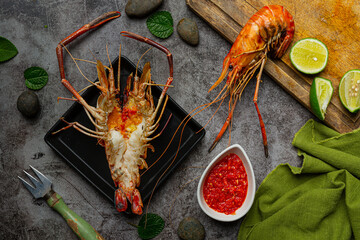 Large river prawns grilled and ready to eat Decorated with beautiful side dishes.