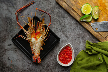 Large river prawns grilled and ready to eat Decorated with beautiful side dishes.