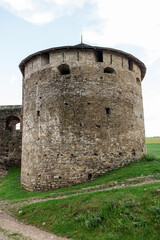 Fototapeta na wymiar Medieval stone tower, part of the castle, fort, protective structure, stone fortress, landmark of Ukraine, kamianets podilskyi.