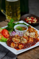 Spicy fresh oyster salad and Thai food ingredients.