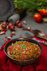 Ong chili paste in a mortar Decorated with beautiful side dishes.