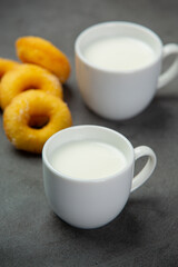 Delicious fresh milk in a glass on a black background.