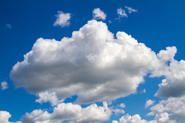 Naklejka na ściany i meble Blue sky background with white clouds