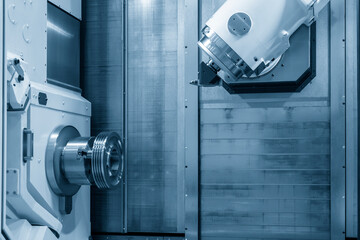 The multi-tasking machining center cutting the automotive parts. Hi-precision manufacturing process...