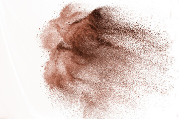 Fototapeta premium Golden colored sand splash against white background.&nbsp;