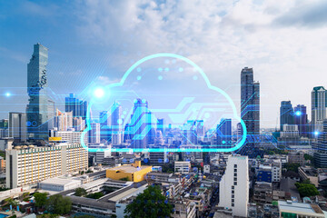 Storage cloud hologram over panorama city view of Bangkok, tech hub in Asia. The concept of developing new approaches to store digital information. Double exposure.
